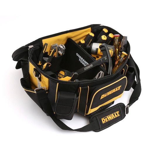 A DEWALT branded black and yellow tool bag filled with various hand tools such as screwdrivers, pliers, a hammer, and measuring tape. The bag features multiple compartments and a shoulder strap.