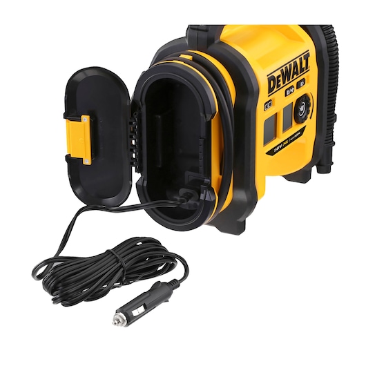 DEWALT portable air compressor showing an open compartment with a coiled power cord and a 12V car plug. The main unit is yellow and black and features control buttons on the side.