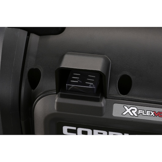 Close-up of a DEWALT XR FLEXVOLT battery connection port on a black power tool.