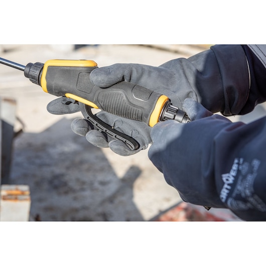 DEWALT DCCS1100N-XJ, DCCS1100N tool in gloved hands, close-up, for photography category.