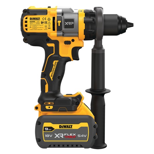 A DEWALT DCD999X1 XR FlexVolt 18V/54V cordless drill with a side handle and brushless motor. The drill features a yellow and black design and a large battery pack rated at 9Ah.