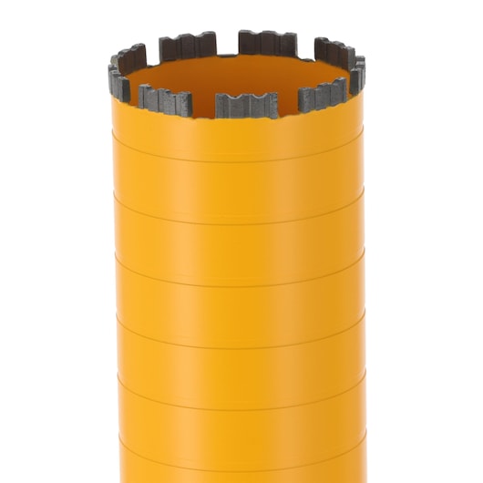 Close-up of a yellow DEWALT cylindrical drill bit with segmented cutting edge, used for coring applications.