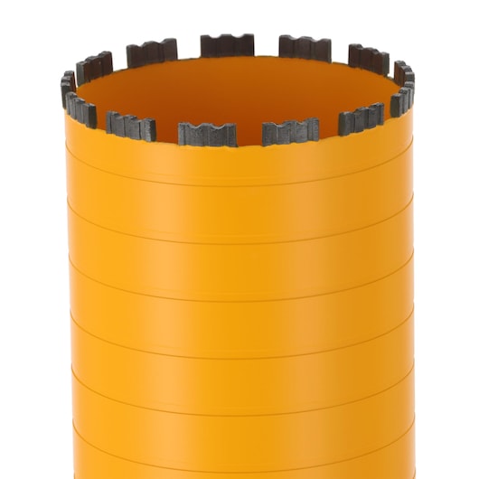 Close-up of an orange DEWALT cylindrical core drill bit with segmented cutting edge.
