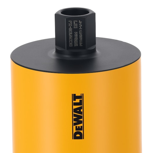 Close-up of DEWALT DCDW108 yellow cylindrical tool with black top, used for drilling or boring applications.