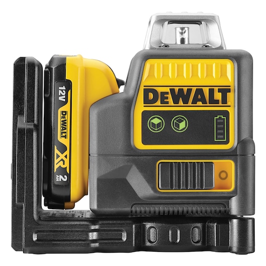 Close-up view of a DEWALT 12V laser level tool with a yellow and black body, mounted on a black base. The DEWALT logo is visible along with indicator icons and a battery pack on the left side.