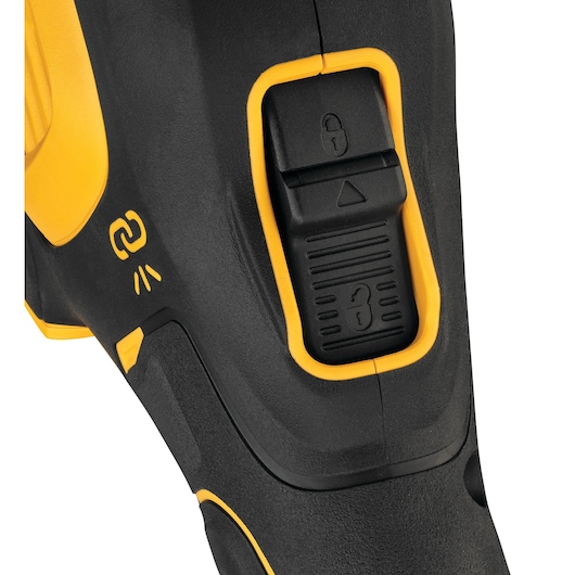 Close-up view of a DEWALT power tool featuring a black and yellow body. The image highlights a lock/unlock switch and a connectivity indicator symbol.