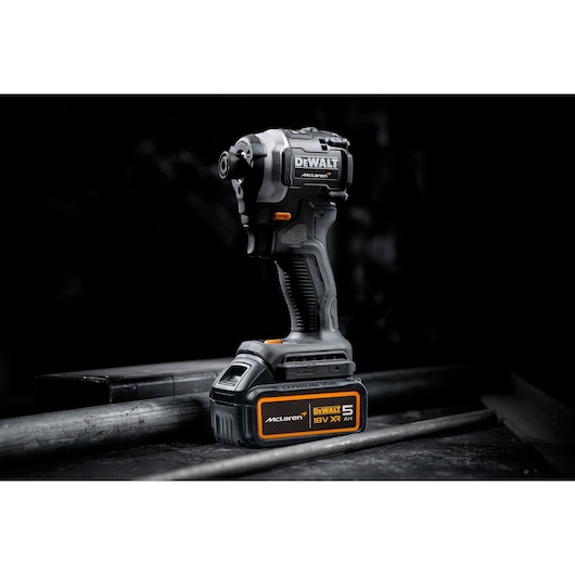DEWALT 18V XR cordless impact driver with McLaren branding shown against a dark background.