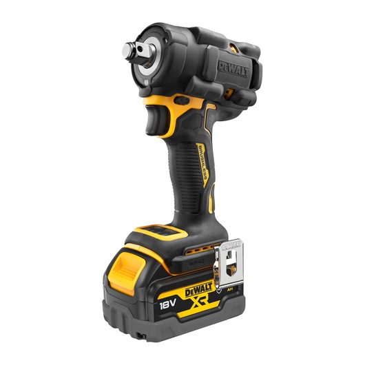 A Dewalt DCF921P2G 18V cordless impact wrench with brushless motor, featuring a yellow and black design, ergonomic grip, metal belt clip, and battery pack attached at the bottom.