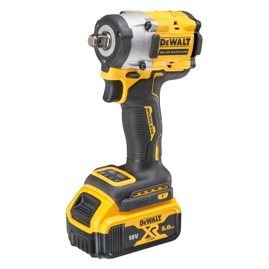 A DEWALT DCF921P2T 18V XR Brushless cordless impact wrench with a 5.0Ah Li-ion battery. The tool has a yellow and black design and ergonomic handle.