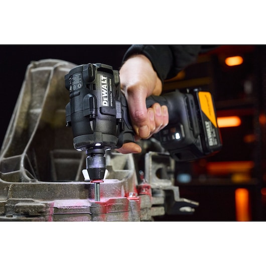 DEWALT DCF92MP2T-QW, DCF92MP2T impact tool in use, tightening a bolt. Photography product category.