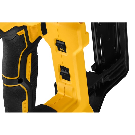 Close-up of a DEWALT power tool, featuring a yellow and black handle with ergonomic grip and two black switches.