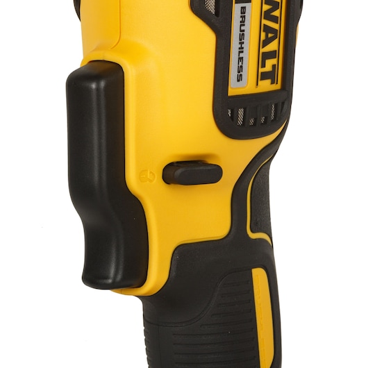 Close-up of the handle and control switch of a DEWALT brushless power tool, showing yellow and black ergonomic design.