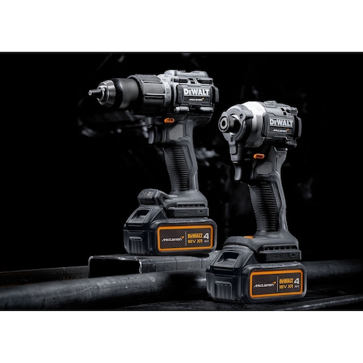 Two DEWALT cordless power tools with 18V XR batteries, shown on a dark background.