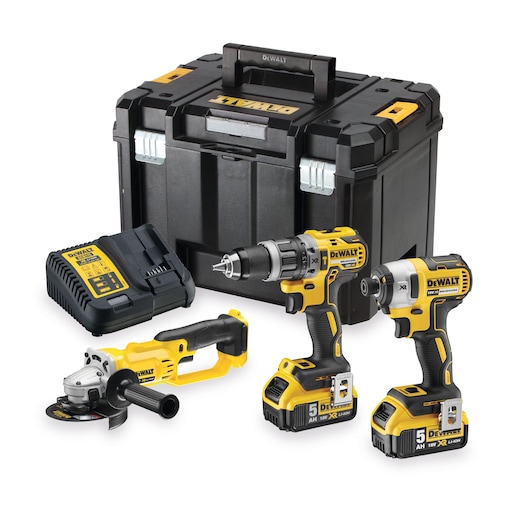 DEWALT tool set with drill, impact driver, grinder, battery charger, and storage box on white background.