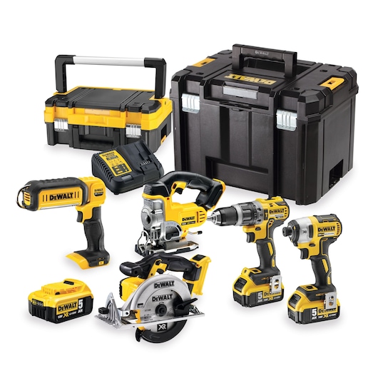 DEWALT tool kit with drills, saws, batteries, charger, and storage cases arranged on a white background.