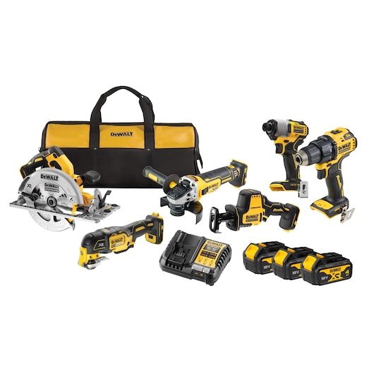 DEWALT tool kit with power tools, batteries, charger, and carrying bag. Tools are yellow and black.