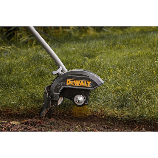 DEWALT edger in use on grass. SKUs: DCMASED9N, DCMASED9N-XE. Product category: Photography.