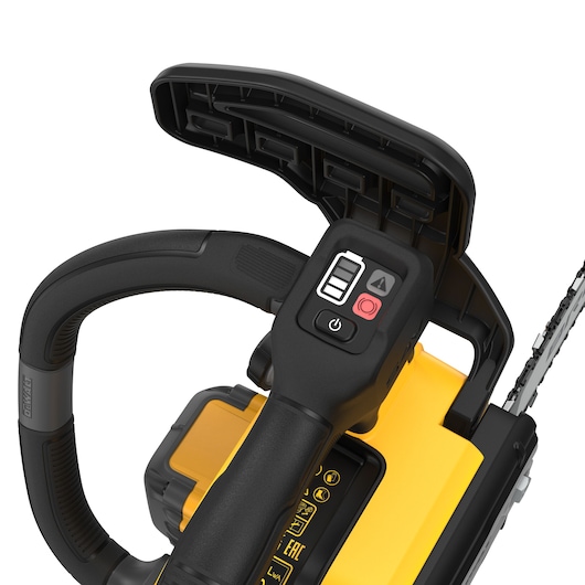 Close-up of DEWALT chainsaw handle and control buttons, showing part of chain and battery compartment.