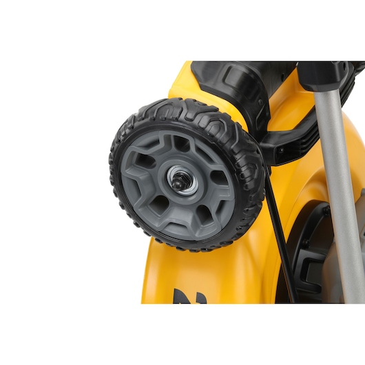 Close-up of a DEWALT lawn mower wheel, showing the tread pattern and attachment mechanism on the yellow body.