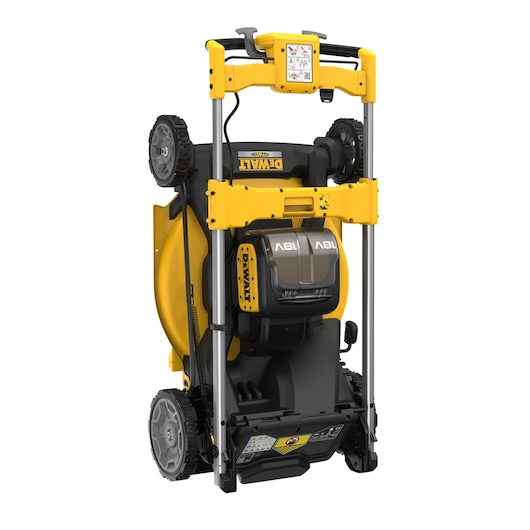 Yellow DEWALT cordless lawn mower shown standing upright for compact storage.