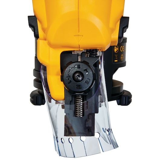 Close-up of a DEWALT tool adjustment knob and guard with visible settings and yellow casing.