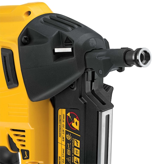 Close-up view of a DEWALT DCN8903 yellow and black power tool, showing the fastening mechanism and caution labels.