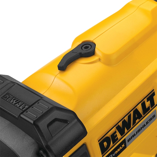 Close-up view of a DEWALT power tool, showing detailed yellow and black casing with a black lever and brand logo.