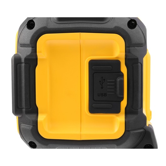 Close-up of DEWALT device showing a USB port cover in black and yellow casing.