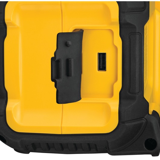 Close-up of a yellow DEWALT device with a black rubber cover and a USB port on its side.