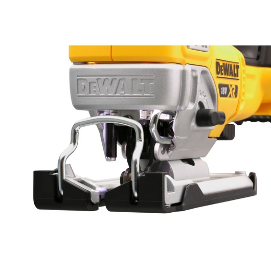Close-up of a DEWALT 18V XR jigsaw showing its blade area and metal base.