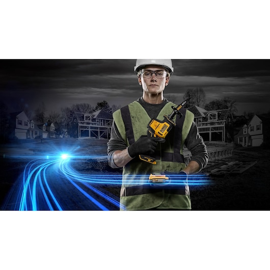Worker holds a DEWALT cordless saw with digital effects and construction site in the background.