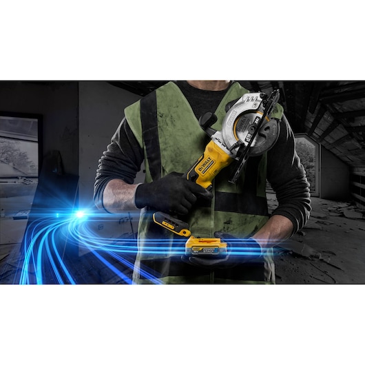 Person holding a DEWALT cordless saw, wearing gloves and vest in a construction setting with blue light streaks.