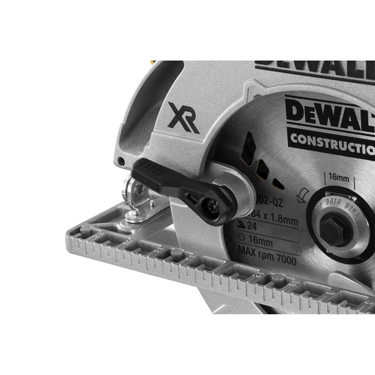 Close-up of a DEWALT XR circular saw showing the blade, adjustment lever, and part of the guide.