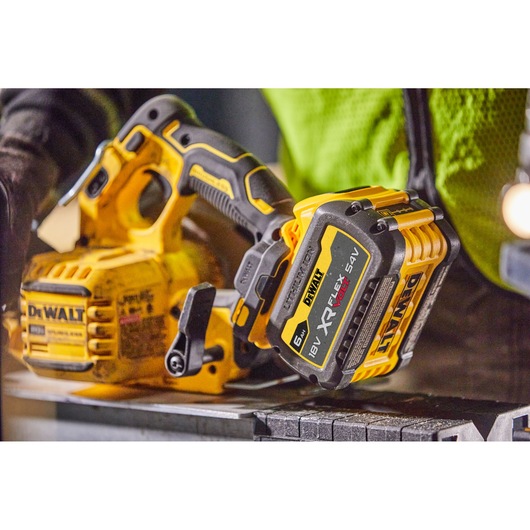 DEWALT cordless circular saw with XR FLEXVOLT battery shown on a workbench.