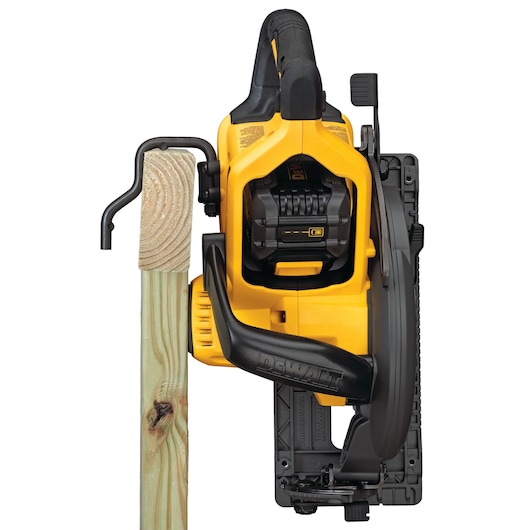 DEWALT cordless circular saw cutting through a wooden plank, shown from above.