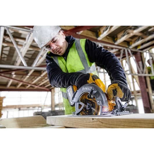 DEWALT tool cutting wood; SKUs DCZ507T2-XE, DCS578N, DCZ503X2-XE; construction site, photography category.