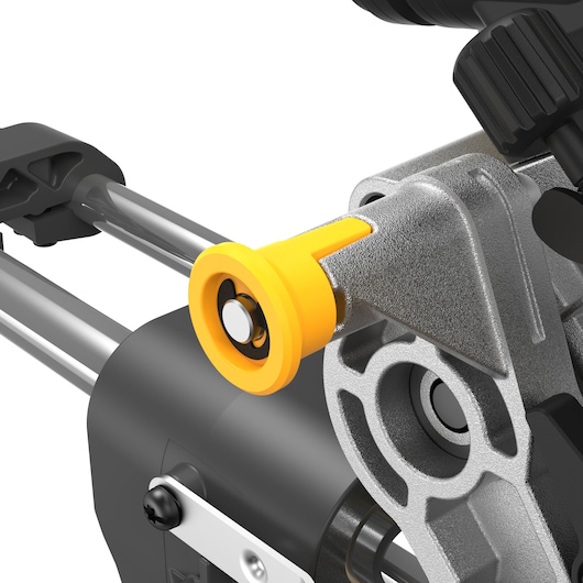 Close-up of DEWALT DCS781N tool component with yellow and metal details, showing part of the mechanism.