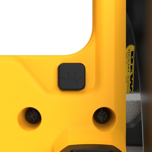 Close-up of DEWALT DCS781N saw's yellow body and its black light button with icon detail.