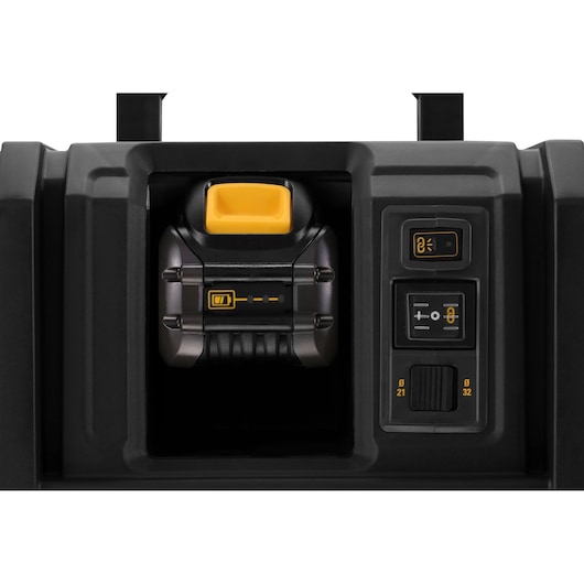 Close-up of a DEWALT DCV586MT2 battery compartment and control panel with yellow and black buttons.