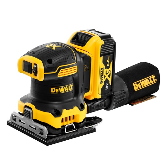 DEWALT cordless sander in black and yellow, with 18V battery and dust bag, placed on a white background.