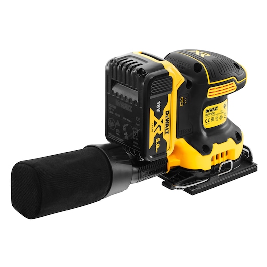 Cordless DEWALT sander with dust bag and 18V battery, yellow and black body, angled view.