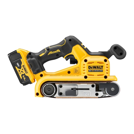 DEWALT cordless belt sander with 18V XR battery, yellow and black, side view against white background.