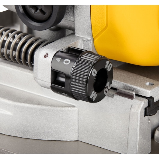 Close-up of the adjustment dial on a DEWALT power tool, showing numbered increments and metal components.