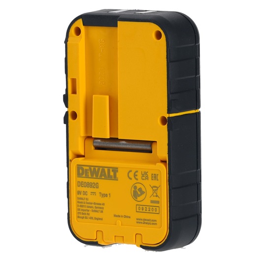 Rear view of a DEWALT DE0892G yellow and black electronic device, showing a battery compartment and product information label.