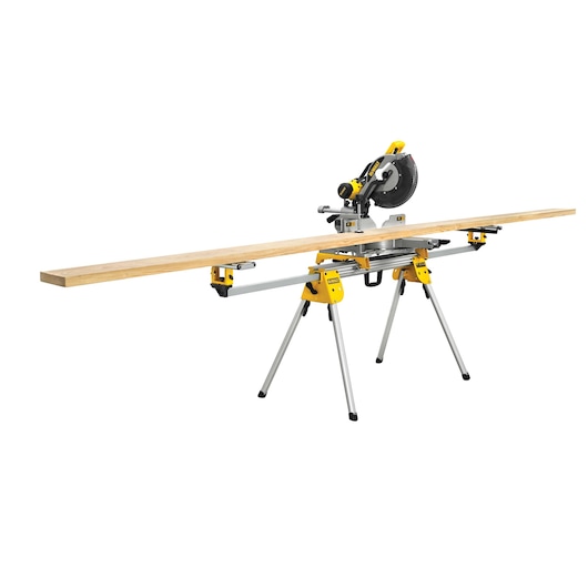 DEWALT miter saw with stand and a long wooden plank, designed for accurate cutting in woodworking tasks.