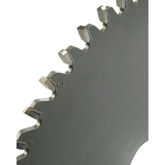 Close-up view of a DEWALT saw blade edge showing metal teeth.