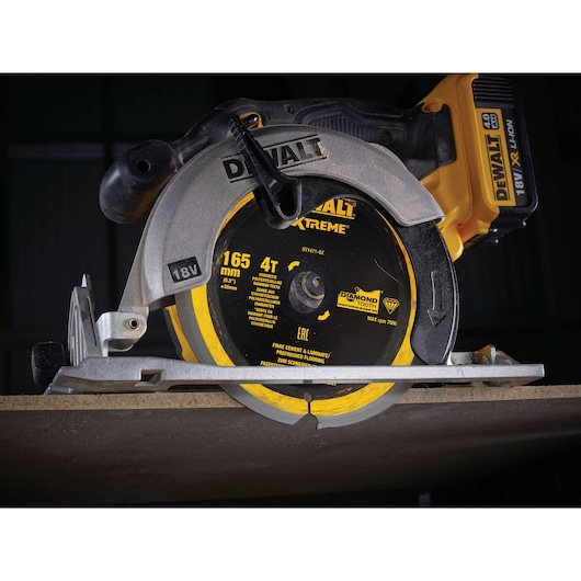 DEWALT DT1471 circular saw cutting board, showing blade, 18V battery, and tool details close-up.