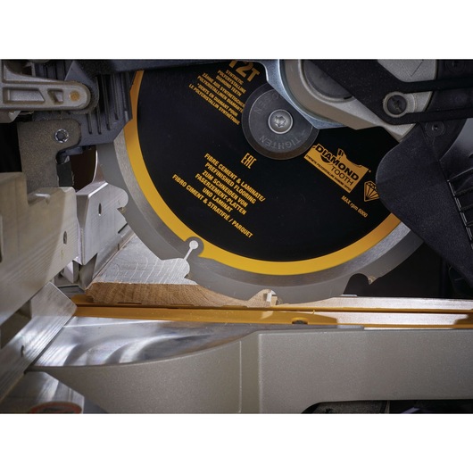 Close-up of a DEWALT DT1474 circular saw cutting wood, showing the diamond tooth blade in action.