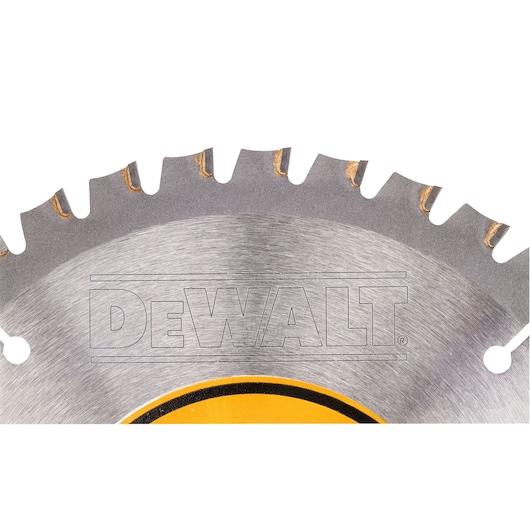 Close-up view of a DEWALT branded circular saw blade showing metal teeth and part of the logo.
