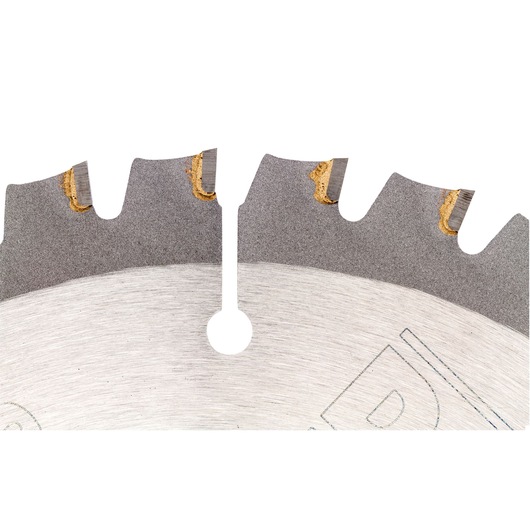 Close-up view of a circular saw blade showing its sharp teeth and metallic surface, with small notches and yellow-tinted welds on the tips.